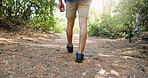 Hiking, walking and legs of man on mountain with backpack for adventure, trekking and travel. Nature, fitness and person outdoors with stick for wellness, fresh air and exercise to explore outdoor