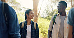 Hiking, happy and people in nature talking for adventure, trekking and travel on holiday. Mountain. friends and man and woman outdoors in conversation for wellness, fresh air and exercise to explore