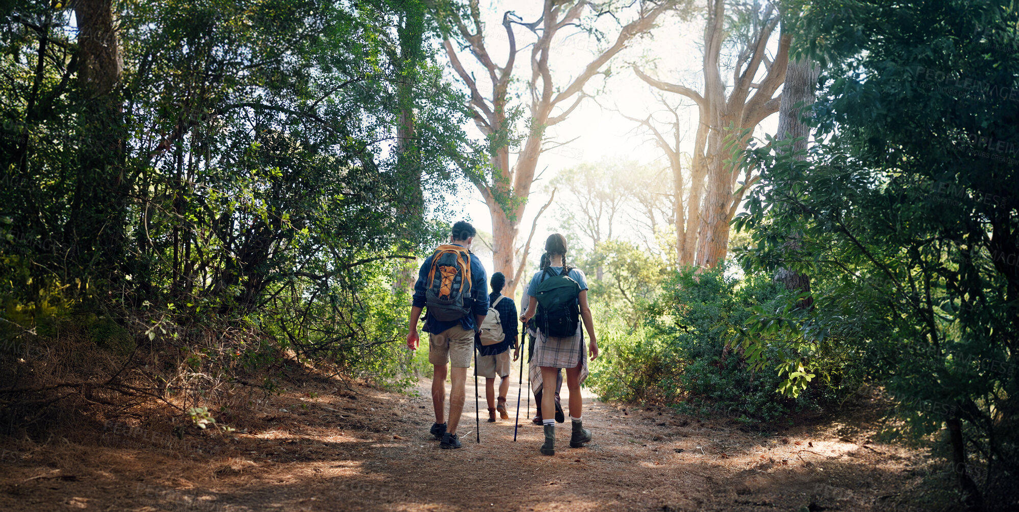 Buy stock photo Hiking, back and people in nature walking for adventure, trekking and travel on holiday. Mountain, friends and men and women for hobby on trail for wellness, fresh air or exercise to explore outdoors