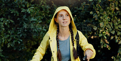 Buy stock photo Trekking, walking and woman explore forest with flashlight, travel adventure and holiday expedition. Mission, person and hiking with backpack in woods for sightseeing, raincoat and winter journey