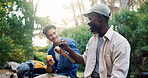 Fist bump, friends and men hiking outdoor, eating break and support for travel, solidarity and adventure together. Hand gesture, united and hiker team relax while trekking, holiday and fruit snack