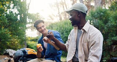 Buy stock photo Fist bump, friends and men hiking outdoor, eating break and support for travel, solidarity and adventure together. Hand gesture, united and hiker team relax while trekking, holiday and fruit snack