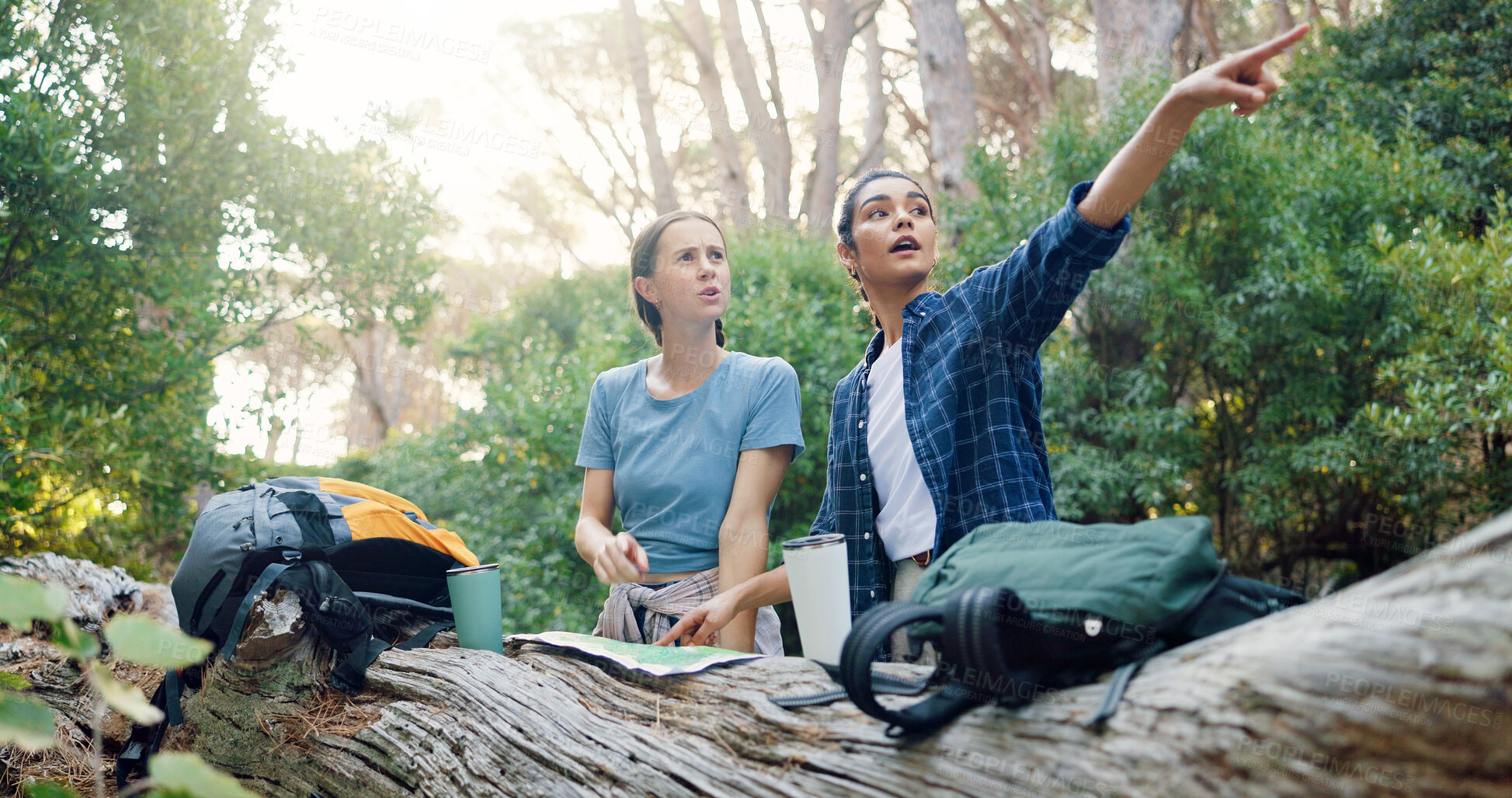 Buy stock photo Hiking, map and women on mountain pointing for navigation, direction and location. Fitness, friends and people in conversation with paper guide on adventure, journey and travel outdoors for trekking