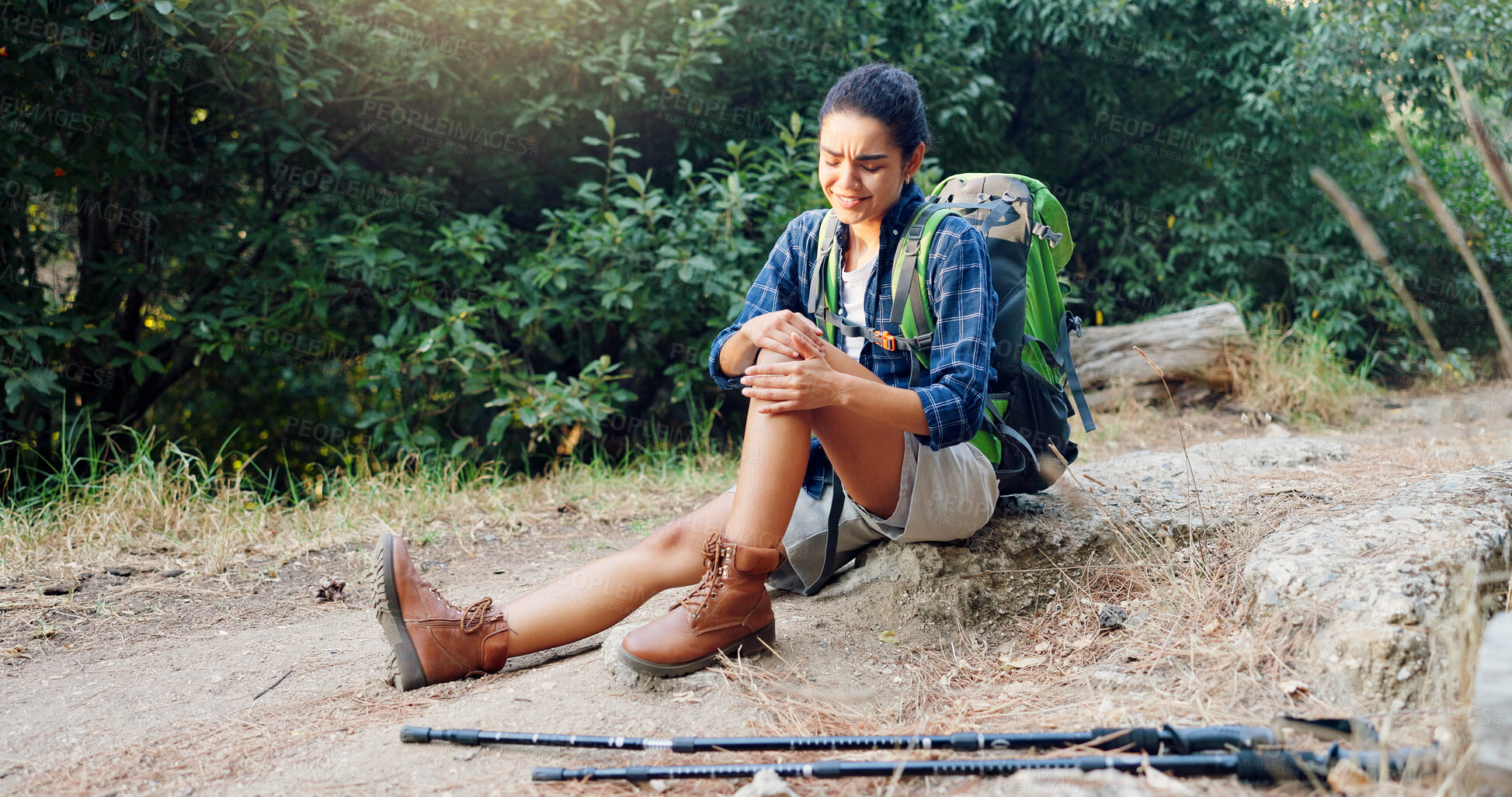 Buy stock photo Woman, hiker and knee injury with pain for accident, fall or emergency on trekking trail or path in nature. Female person, ache or joint inflammation with backpack for sprain, sore leg or strain