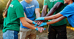 Nature, volunteer and hands stack of people for teamwork at charity, community service and eco friendly outreach. Volunteering, solidarity and men and women for support, connection and collaboration