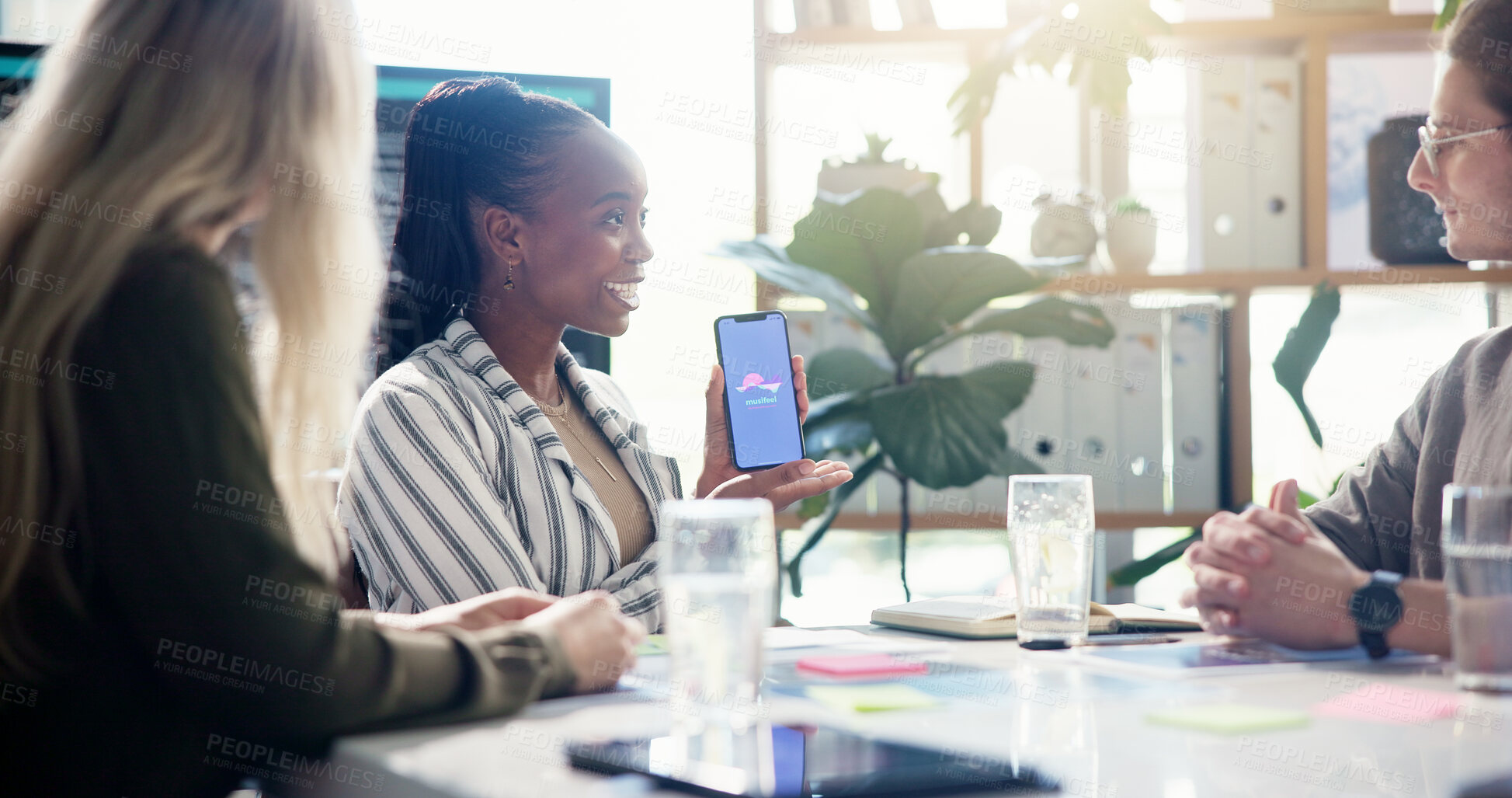 Buy stock photo Meeting, presentation and businesswoman with cellphone in office for app development tutorial. Discussion, programming and female speaker with phone for user interface with collaboration in workplace