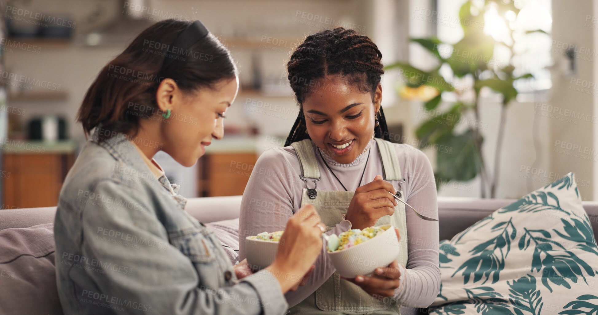 Buy stock photo Bonding, ice cream and woman friends on sofa in living room of home together for reunion or visit. Conversation, relax and sharing with happy people in apartment for gossip, relationship or social