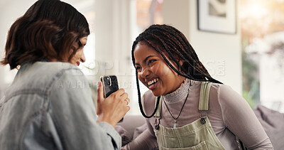 Buy stock photo Home, friends and girls with smartphone, laughing and bonding with gossip on social media and conversation. House, smile and people with mobile for funny news on post, tech or together in living room