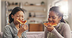 Women, friends and eating with pizza on sofa for lunch, snack and relax with fast food in home. Girls, people and happy on living room couch with weekend, break and celebration together in house
