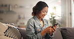 Home, relax and woman on couch, smartphone and typing with smile, social media or internet. Funny meme, mobile user or happy person on sofa, cellphone or digital app for message to contact or texting