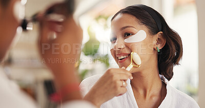 Buy stock photo Eye mask, facial massage and skincare with friends in home together for beauty or pampering. Aesthetic, smile and transformation with happy women in bathroom of apartment for dermatology routine