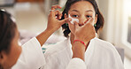Apply, beauty and eye mask with women in home together for pampering or skincare treatment. Aesthetic, antiaging and transformation with friends in bathroom of apartment for dermatology routine