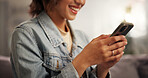 Happy woman, hands and typing with phone on sofa for communication or social media at home. Closeup, female person or user with smile on mobile smartphone for network app, online chatting or texting
