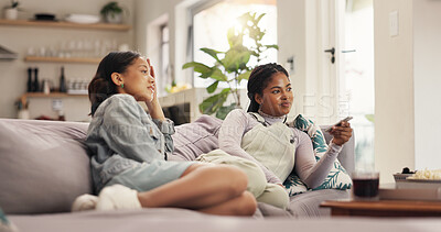 Buy stock photo Watching tv, women and friends with phone, smile and bonding with reality show, relax and entertainment. Home, girls and people with mobile app to change channel, together and streaming of movies