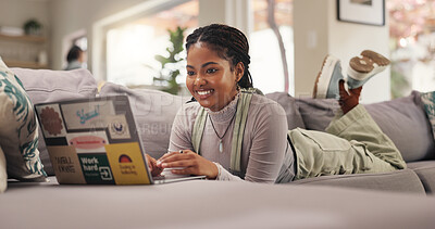 Buy stock photo Happy, black woman or student with laptop on sofa for college application or acceptance at home. Female person, research or smile with computer on couch for academic results or online course at house