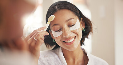 Buy stock photo Beauty, eye mask and face roller with friends in home together for pampering or skincare. Aesthetic, massage and transformation with happy women in bathroom of apartment for dermatology routine