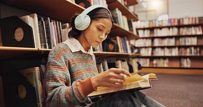 Buy stock photo Woman, student and headphones at library with reading book on floor, study and song with scholarship at college. Girl, education and listening to music, streaming and prepare for test at university