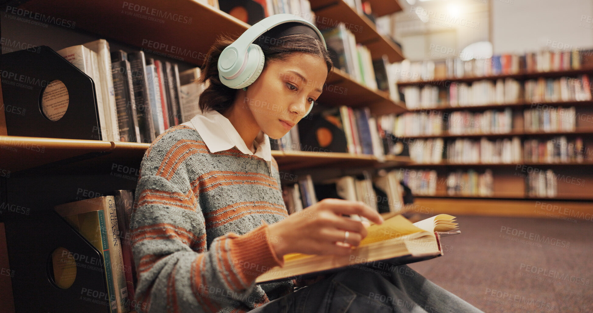 Buy stock photo Woman, student and headphones at library with reading book on floor, study and song with scholarship at college. Girl, education and listening to music, streaming and prepare for test at university