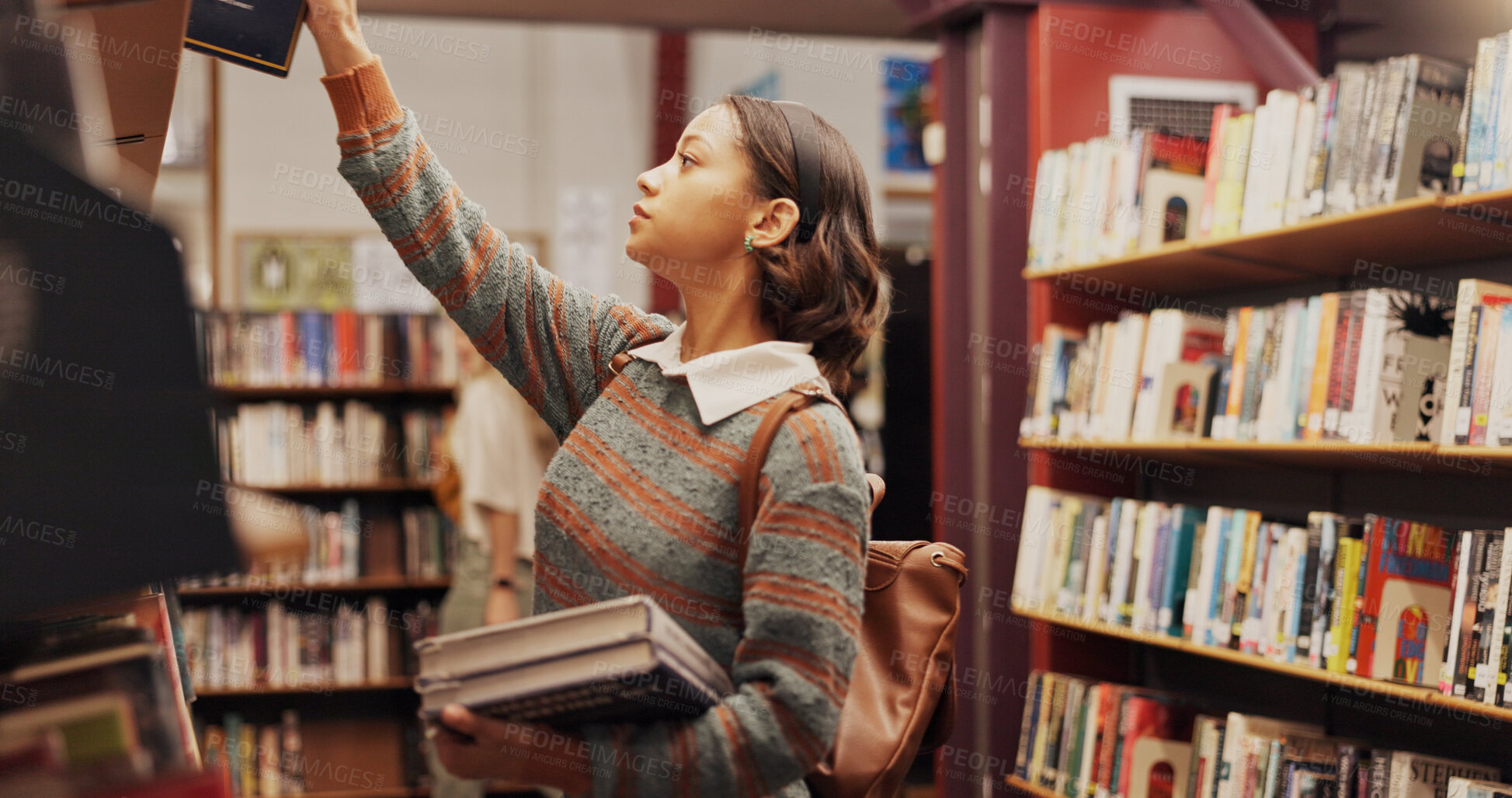 Buy stock photo Girl, shelf and learning with books in library for choice, studying and preparation of exam. Student, return and textbook decision for information, university knowledge and wisdom of education thesis