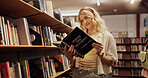 Woman, student and reading book in library for learning, financial study and business course. Person, finance textbook and knowledge with investment information, education exam and advice for growth
