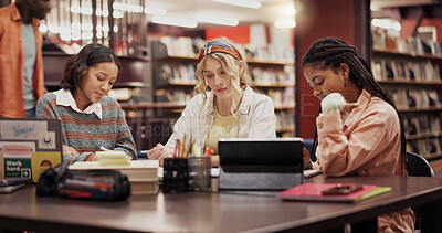 Buy stock photo Education, college and friends with women in library for assignment, reading and study group. University, learning and teamwork with people on campus for knowledge, students and research project