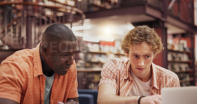 Buy stock photo Students, men and friends with laptop at library for group project, research or education at university. People, computer and review with problem solving, point or learning for scholarship at college