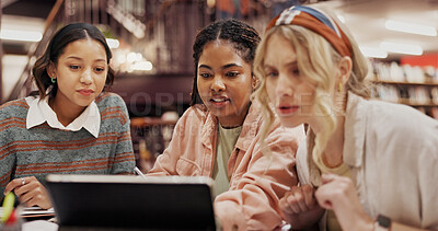 Buy stock photo Study group, tablet and reading with women in library for college assignment, research and education. University, learning and teamwork with people on campus for knowledge, students and project