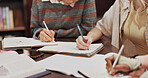 Library, writing and hands of students with notebook for exam, learning and knowledge in education. College, campus and people with paper for studying, support and preparation for university test