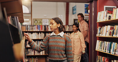 Buy stock photo Girl, student and shelf with books in library for choice, textbook search and studying for exam. Female person, decision and literature information for knowledge, education and assessment at college