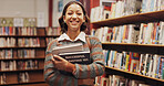 Portrait, woman and smile with books in library for research, study marketing and career preparation. Student, textbook and information for business knowledge, educational exam and university project