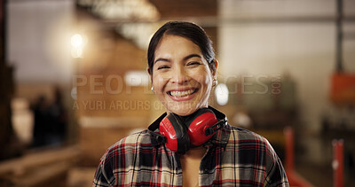 Buy stock photo Portrait, happy carpenter and woman in workshop for furniture manufacturing and production. Woodwork, smile and professional at industrial factory for joinery, carpentry and ear protection headphones