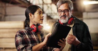Buy stock photo Online, team and people with tablet, carpenter and intern with research for woodworking technique. Workshop, mature mentor and review of info on tech, woman and collaboration for furniture business