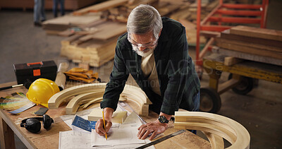 Buy stock photo Wood, blueprints and carpenter or man and drawing for production, furniture or manufacturing. Sketching, handyman and framework with mature craftsman in factory for building project or construction