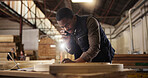 Phone call, laptop and black man in carpentry workshop for furniture, manufacturing and lumber renovation. Construction, factory and carpenter on smartphone for online orders, inventory and timber