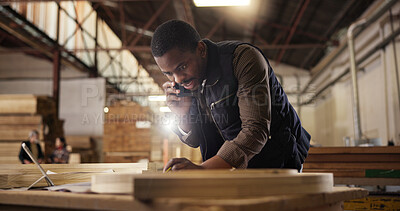Buy stock photo Phone call, laptop and black man in carpentry workshop for furniture, manufacturing and lumber renovation. Construction, factory and carpenter on smartphone for online orders, inventory and timber