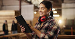 Carpentry, factory and business woman on tablet for online planning, schedule and inventory. Woodworking, workshop and carpenter on digital tech for manufacturing, furniture and timber production