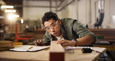 Buy stock photo Man, carpenter and blow with sand paper at workshop for polish, craft or timber project. Male person, woodworker and safety glasses with wooden repair, design or restoration at construction warehouse