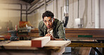 Man, carpenter and beam with workbench at workshop for polish, craft or timber project. Male person, woodworker and safety glasses with wooden repair, design or restoration at construction warehouse