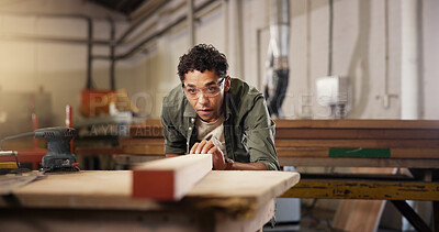 Buy stock photo Man, carpenter and beam with workbench at workshop for polish, craft or timber project. Male person, woodworker and safety glasses with wooden repair, design or restoration at construction warehouse