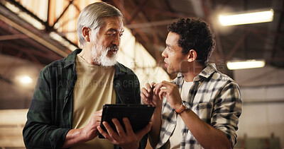 Buy stock photo Carpenter, team and people with tablet, men and online for research in workshop or woodworking technique. Talking, intern and mature mentor with tech for info, collaboration or planning for furniture