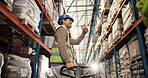 Man, thumbs up and trolley in warehouse for logistics, loading bay and go ahead at packaging. Worker, happy and like emoji in storage facility for approval, good job and low angle in supply chain