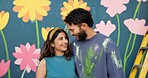 Mural, art and couple hug by wall for creative project, painting and decoration outdoors. Renovation, smile and happy man and woman with inspiration for flowers, aesthetic and diy design together