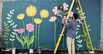 Smile, couple and painting of creative wall for art project, mural design and helping for improvement. Happy, people and artist on ladder for community renovation, diy decoration and flower aesthetic