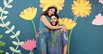 Hug, wall and portrait of couple for painting, creative project and decoration outdoors. Happy, smile and man and woman with inspiration for flowers, spring aesthetic and diy art for community centre