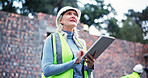 Construction, mature woman and tablet on site for building inspection, project management or renovation progress. Architecture, worker or digital report for compliance check review or quality control