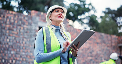 Buy stock photo Construction, mature woman or tablet on site for building inspection, project management or renovation progress. Architecture, worker or digital report for compliance check, review or quality control
