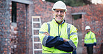 Portrait, architect and man with arms crossed at construction site, inspection and expansion. Mature person, confident and project management in city, quality assurance and property infrastructure