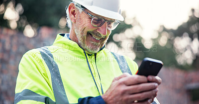Buy stock photo Cellphone, mature man and construction worker on site with contact for renovation approval. Contractor, phone and male civil engineer reading building, maintenance or repairs briefing plan online.