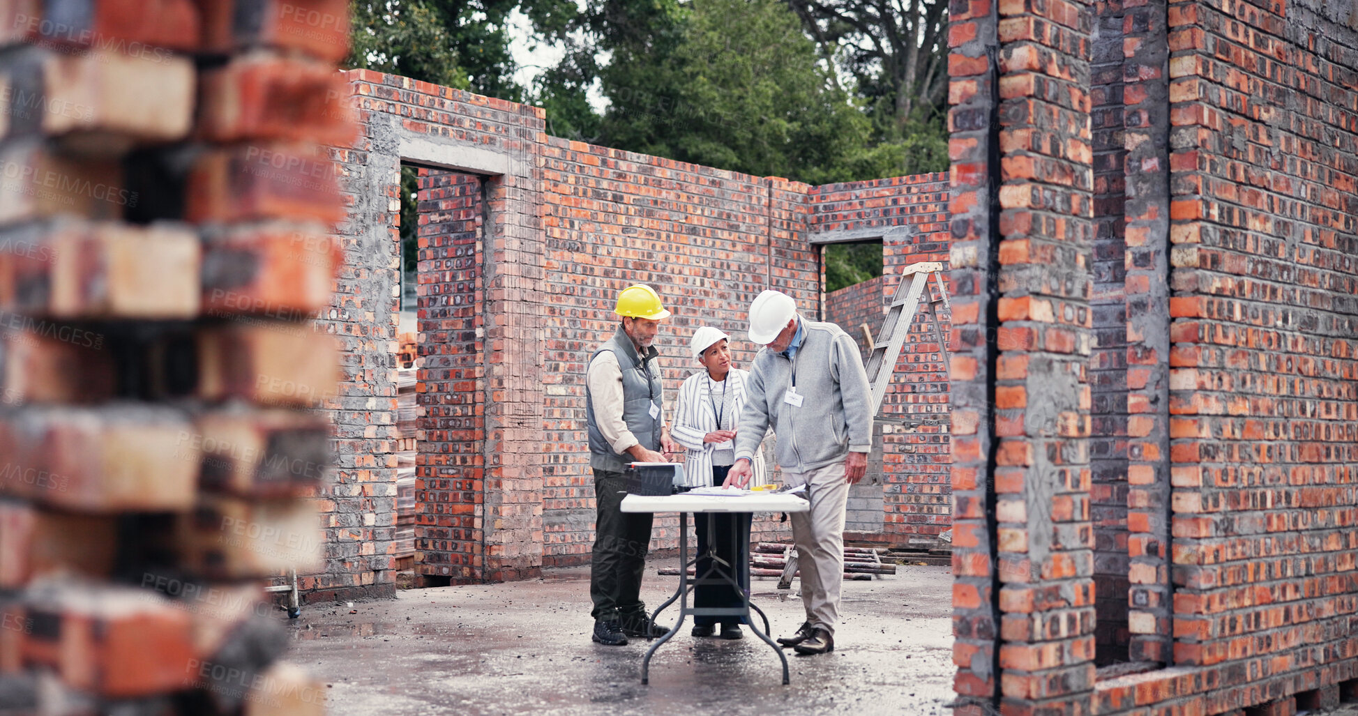 Buy stock photo Construction site, team and planning for collaboration, brainstorming and idea for property development. Men, woman and contractor on worksite for project management, discussion and architect design