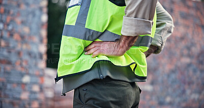 Buy stock photo Hands, person and back pain with construction injury, work site accident or strain with agony outdoor. Spine, contractor burnout with muscle tension or pressure, inflammation or fibromyalgia